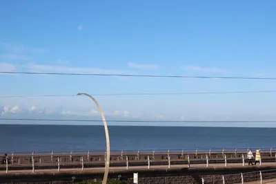 a street light on a bridge over the ocean at The Headlands in Blackpool