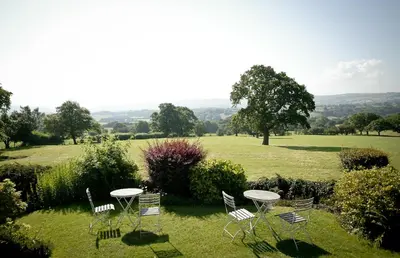 a group of chairs and tables in a field at The Shireburn Arms in Clitheroe