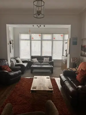 a living room with couches and a coffee table at The Inglewood Hotel *Adults Only* in Blackpool