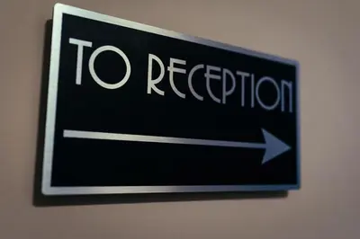 a sign that says to relocation on a wall at The Duke of Edinburgh Hotel & Bar in Barrow in Furness