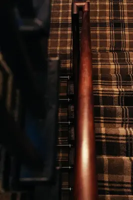 a close up of a stair case with a plaid blanket at The Sun Hotel & Bar in Lancaster