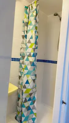 a shower curtain in a bathroom with a shower at Fern Villa Hotel - Albert Road in Blackpool