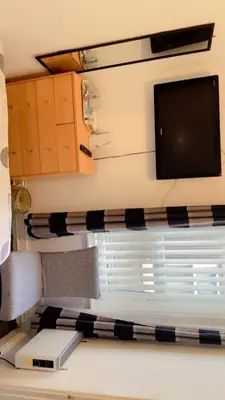 a room with a flat screen tv and a window at Fern Villa Hotel - Albert Road in Blackpool