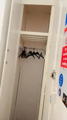 a group of bats hanging on a rack in a door at Fern Villa Hotel - Albert Road in Blackpool