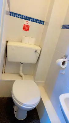 a bathroom with a white toilet and a sink at Fern Villa Hotel - Albert Road in Blackpool