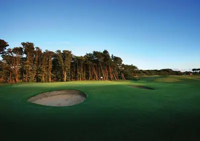 a golf course with a hole in the green at Formby Hall Golf Resort & Spa in Southport