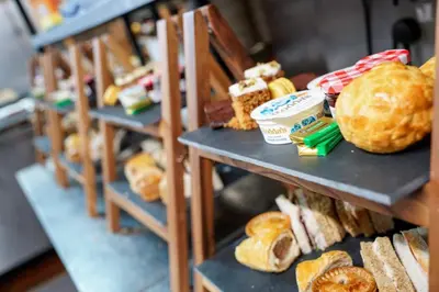 a shelf of bread and pastries in a bakery at Doric Hotel in Blackpool
