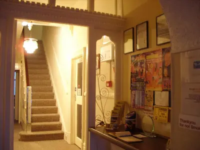 a hallway with a staircase and a stair case at The Croydon in Blackpool