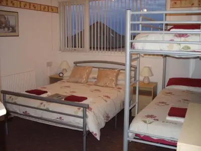 a bedroom with two bunk beds in a room at The Croydon in Blackpool