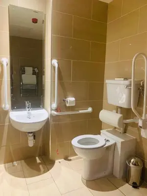 a bathroom with a toilet and a sink at Hard Days Night Hotel Liverpool in Liverpool
