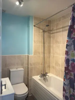 a bathroom with a toilet and a tub and a sink at In Our Liverpool Home Sleeps 5 in 2 Double & 1 Single Bedrooms in Liverpool