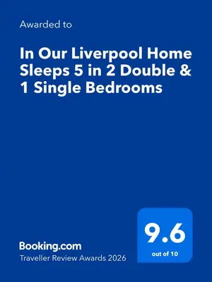 a screenshot of a phone with the words in our layered home sleeps in at In Our Liverpool Home Sleeps 5 in 2 Double & 1 Single Bedrooms in Liverpool