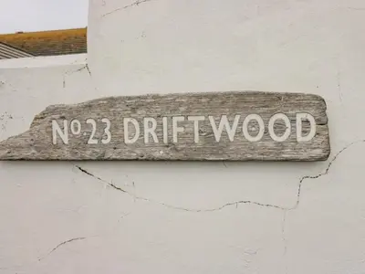 a sign that reads no driftwood on a wall at Driftwood Cottage Roa Island Piel Island in Barrow in Furness