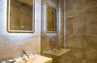 a bathroom with a sink and a shower at Winckley Stays in Preston