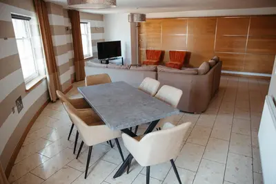 a living room with a table and a couch at Posh Pads - Liverpool 1 - Apart-Hotel in Liverpool