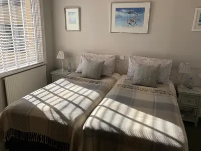 two beds sitting next to each other in a bedroom at The Norwood Guest House in Southport