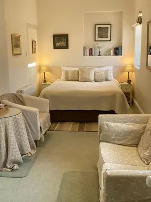 a bedroom with two beds and a couch at The Norwood Guest House in Southport