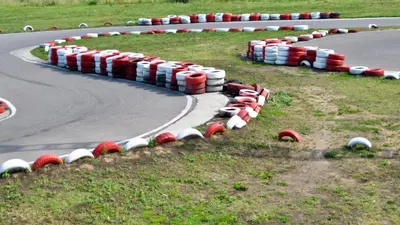 a row of red and white barriers on a race track at Holiday Inn Haydock by IHG in Haydock