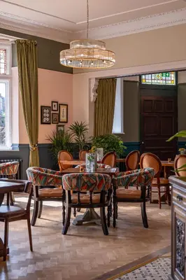 a living room with a table and chairs at Toll House Inn in Lancaster