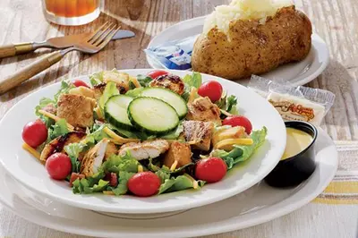 a plate of food with a salad and a loaf of bread at Lexham Hotel in Blackpool