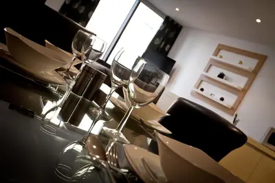 a group of wine glasses sitting on a table at Merchant Quarters Apartments in Liverpool