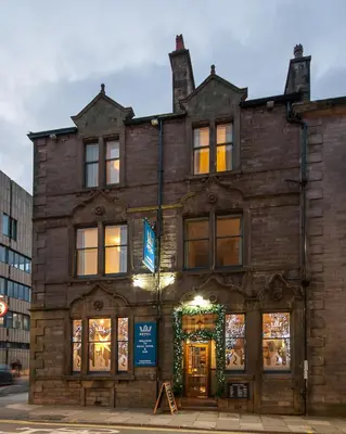 a brick building with a christmas wreath on it at The Royal Hotel and Bar in Lancaster