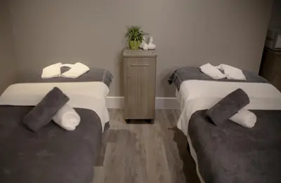 a bedroom with two beds with pillows on them at Netherwood Hotel & Spa in Grange Over Sands