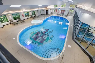an overhead view of a large swimming pool in a building at Thurnham Hall Resort in Cockerham