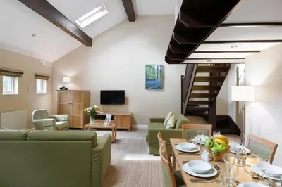 a living room with a couch and a table at Thurnham Hall Resort in Cockerham