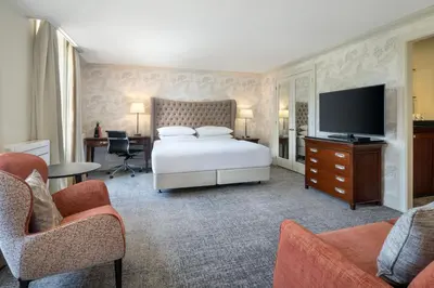 a bedroom with a bed and a flat screen tv at Delta Hotels by Marriott Preston in Preston