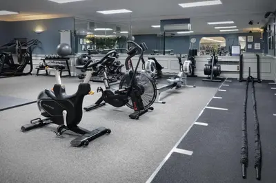a gym with several bikes and exercise equipment at Delta Hotels by Marriott Preston in Preston