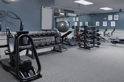 a gym with lots of exercise equipment in a room at Delta Hotels by Marriott Preston in Preston