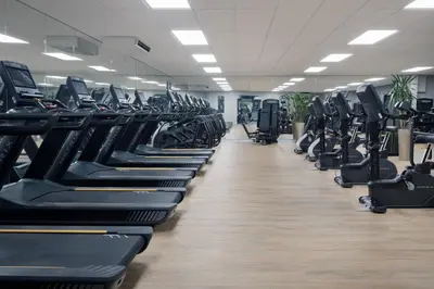a large gym with rows of tread machines at Delta Hotels by Marriott Preston in Preston