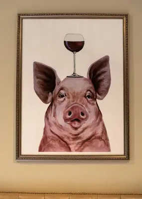 a picture of a pig with a glass of wine on its head at The Lower Buck Inn in Clitheroe