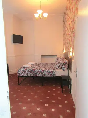 a bedroom with a bed in a room at Belroy Hotel in Blackpool