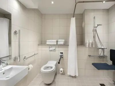 a bathroom with a toilet and a sink at Delta Hotels by Marriott Liverpool City Centre in Liverpool