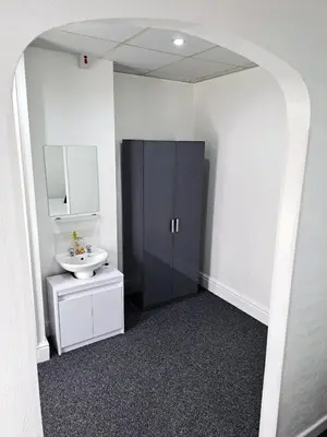a bathroom with a sink and a toilet and a mirror at The Mornington Hotel in Blackpool