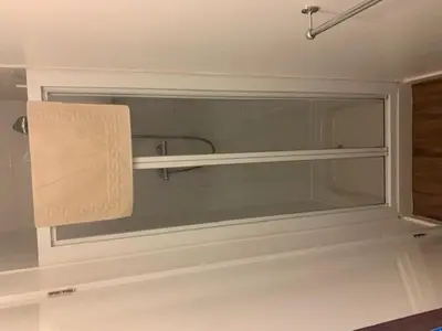 a glass window in a bathroom with a towel at The Mornington Hotel in Blackpool