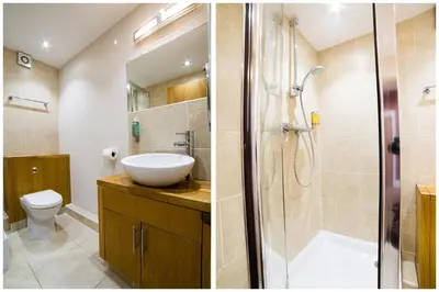 a bathroom with a sink and a toilet and a shower at OYO Imperial Hotel in Barrow in Furness