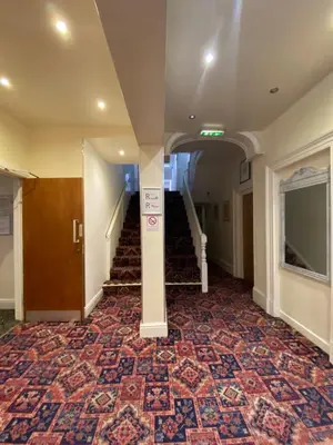 an empty hallway with stairs in a building at South Beach Hotel in Blackpool