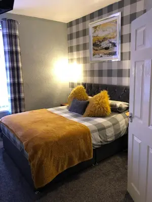 a bedroom with a bed with pillows on it at Springfield Hotel in Blackpool