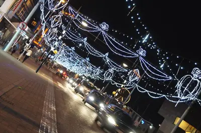 a street filled with christmas lights on a street at Fairhaven Holiday Flats in Blackpool
