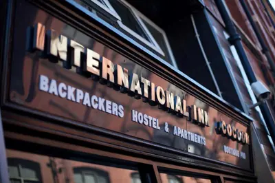 a sign on the side of a building at Cocoon @ International Inn + Apartments in Liverpool