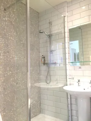 a bathroom with a shower and a sink at St Ives Hotel in Lytham St Annes