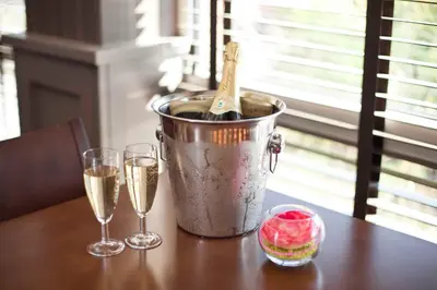 a bucket of champagne and two glasses on a table at St Ives Hotel in Lytham St Annes