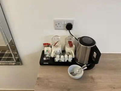 a coffee maker on a black tray on a counter at The Claremont Preston in Preston