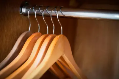 a bunch of wooden hangers in a closet at Wagon & Horses in Lancaster