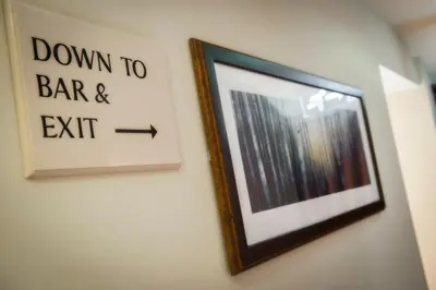 a picture hanging on a wall with a sign on it at Wagon & Horses in Lancaster