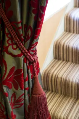 a curtain with a broom next to some stairs at Wagon & Horses in Lancaster