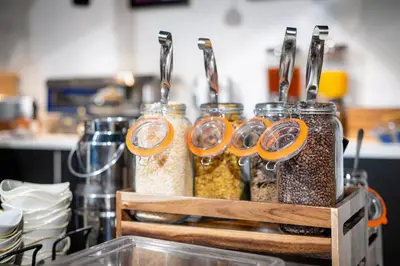 a group of jars filled with food items on a counter at Staycity Aparthotels Liverpool Waterfront in Liverpool